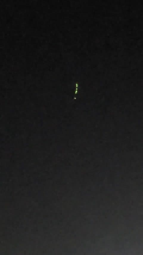 Two groups of lights filmed over Rio de Janeiro before dawn